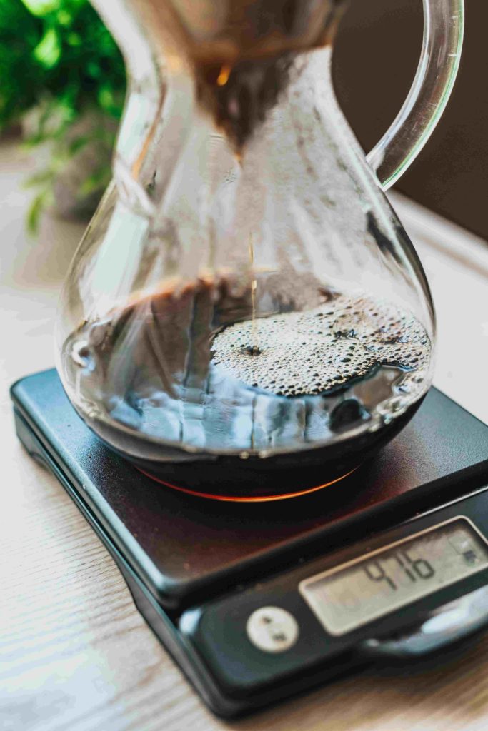 Coffee dripping into a coffee jug v60. Sitting on a measuring scale